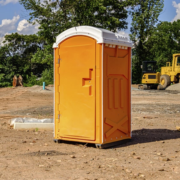 what is the cost difference between standard and deluxe portable restroom rentals in Garrett